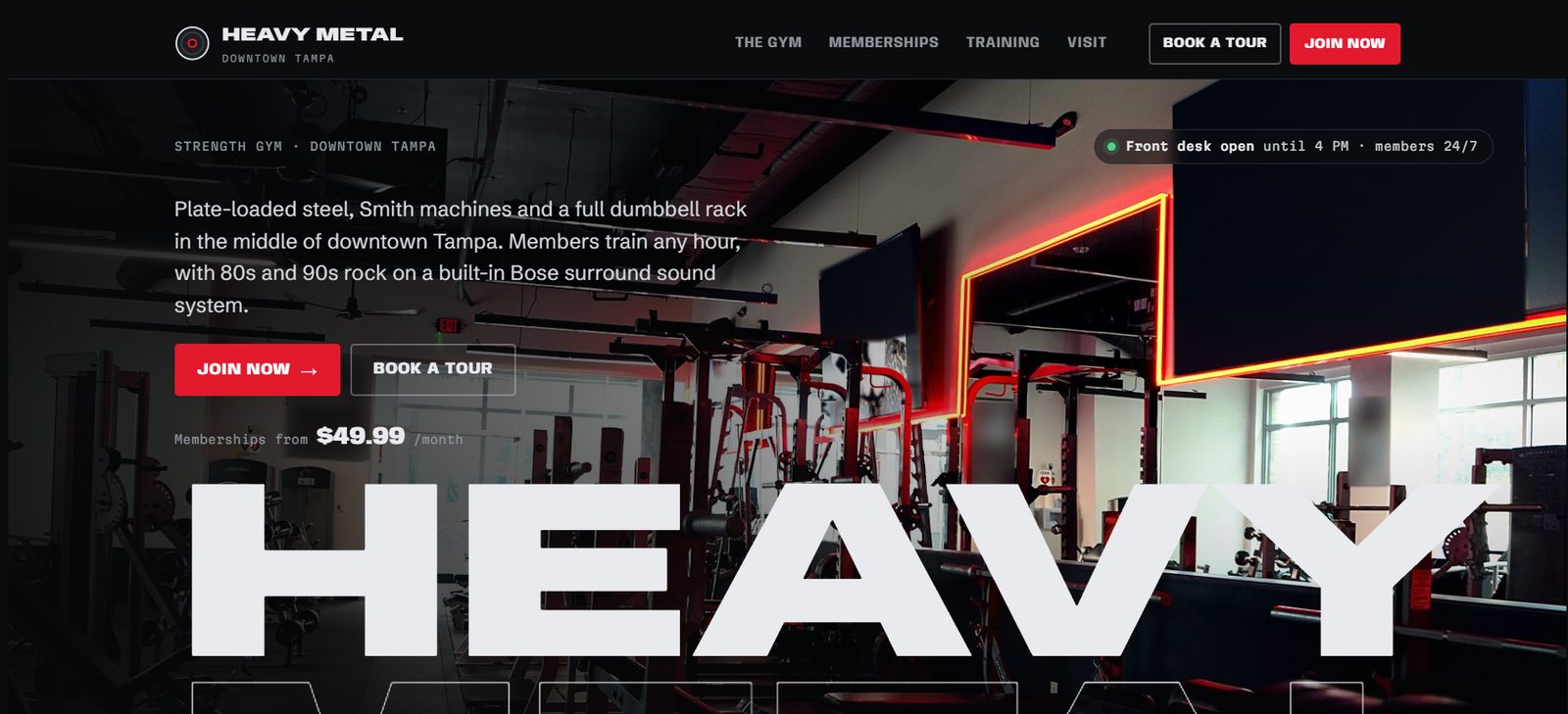 Heavy Metal Gym home page: dark hero photo of the gym floor with membership pricing